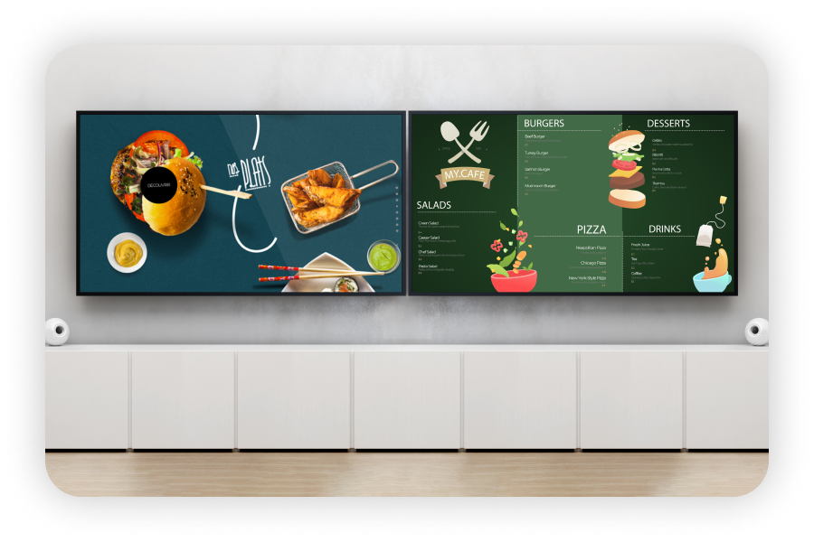 Multiple digital boards are placed on a wall that displays the restaurant logo and menu on the screen.