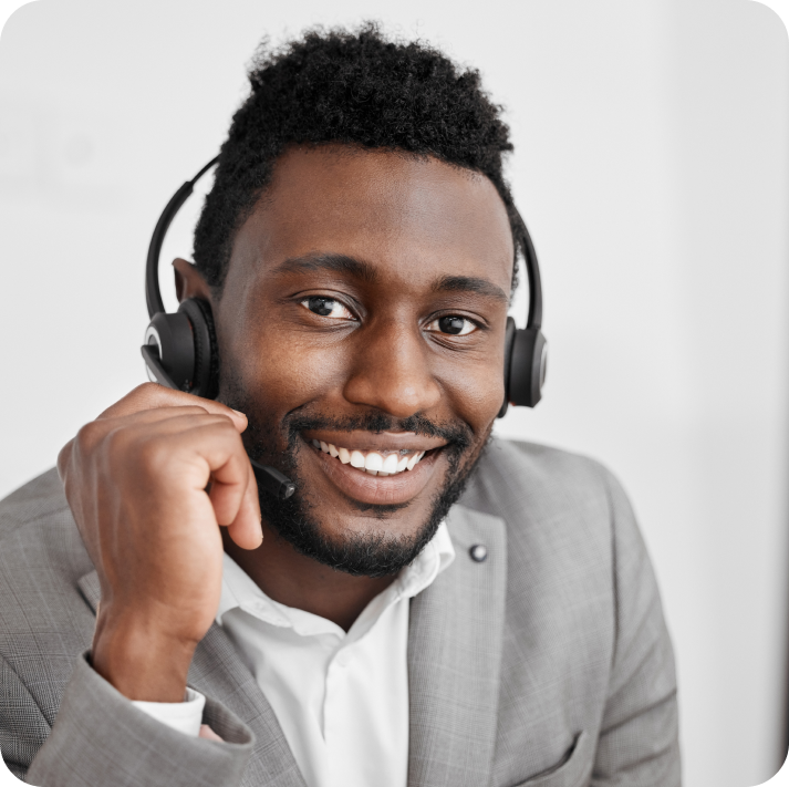 A happy call center agent wearing headset.