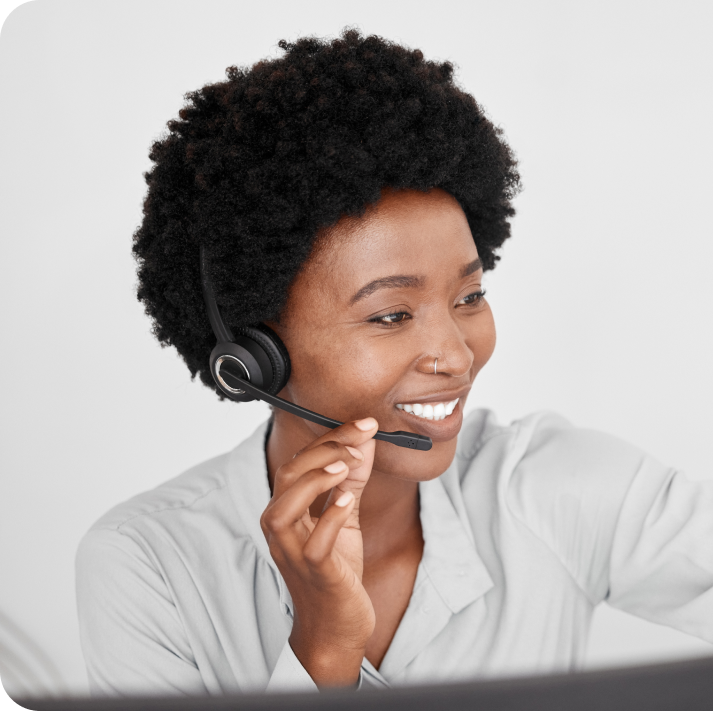 A female call center consultant is talking with a client on call.