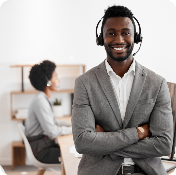 The call center customer service agent is standing while wearing the headset.