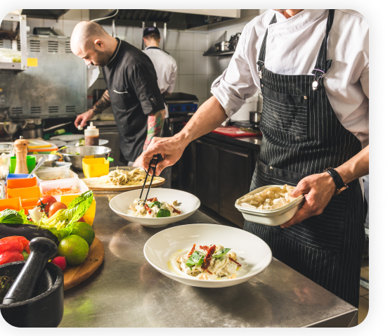 Chefs are preparing food in the full-service restaurant kitchen.