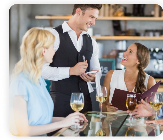 A waiter is taking the order from the female customer.