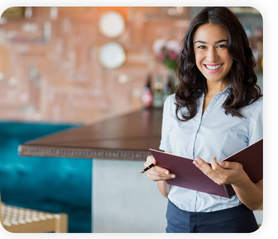A waitress standing in the restaurant is holding order book.