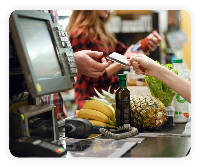 grocery cashier completing a transaction