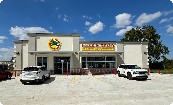 Grab-N-Geaux convenience store storefront featuring branded exterior signage, customer entrance, and front parking area.