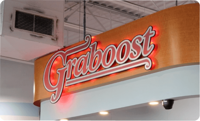 Graboost convenience store signage displayed above a retail service counter inside a store location.