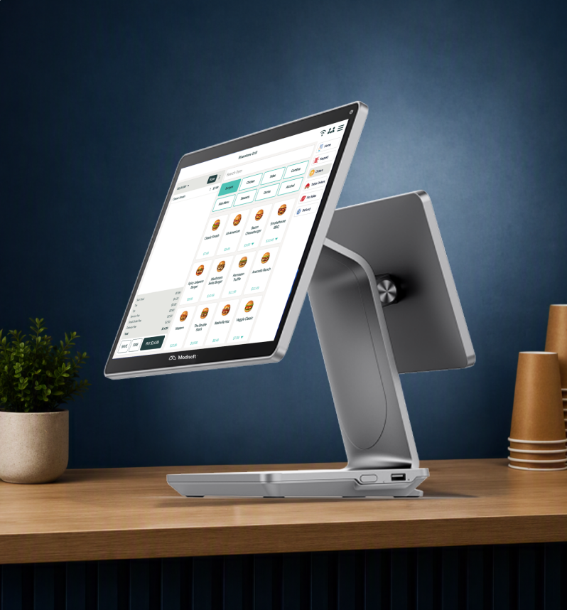 Modisoft M26 Counter Station displaying a touchscreen point of sale interface on a countertop.